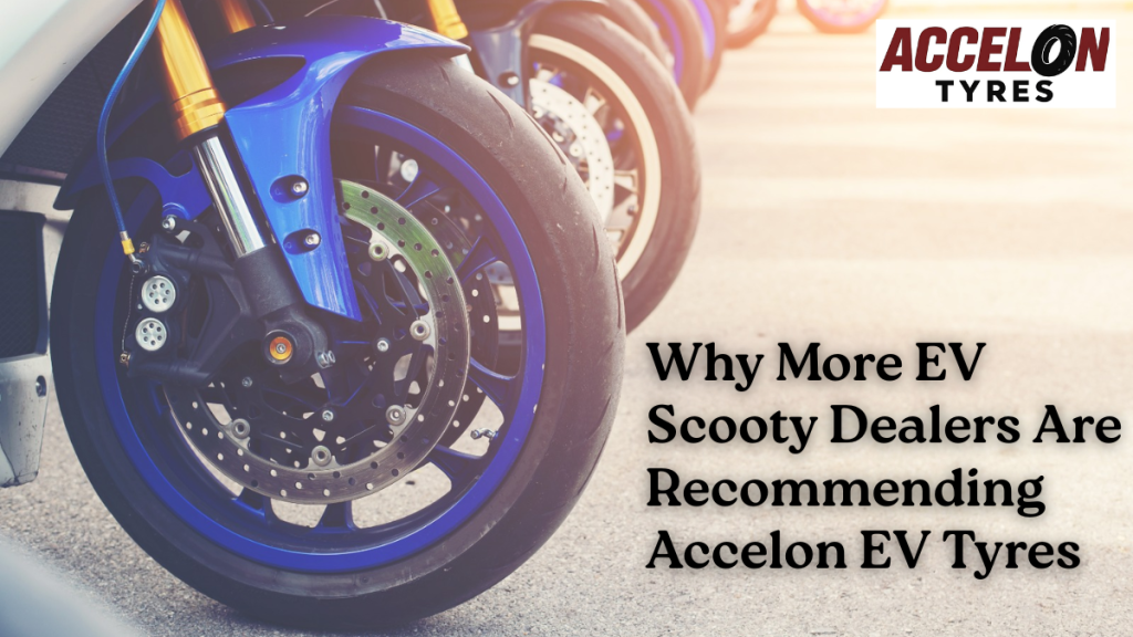 Front wheel of an electric scooter fitted with Accelon Tyres, showcasing premium EV tyre design on a smooth road surface.